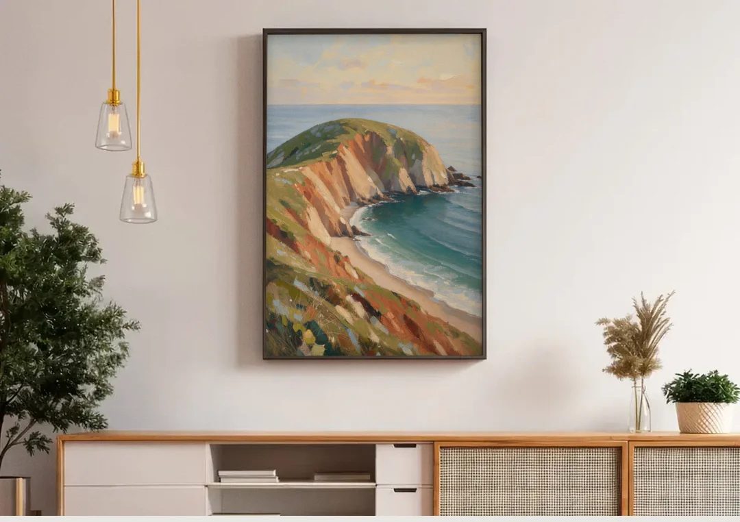 Coastal Canvas Prints of a Headland Cove canvas wall art above a wooden sideboard under pendant lights