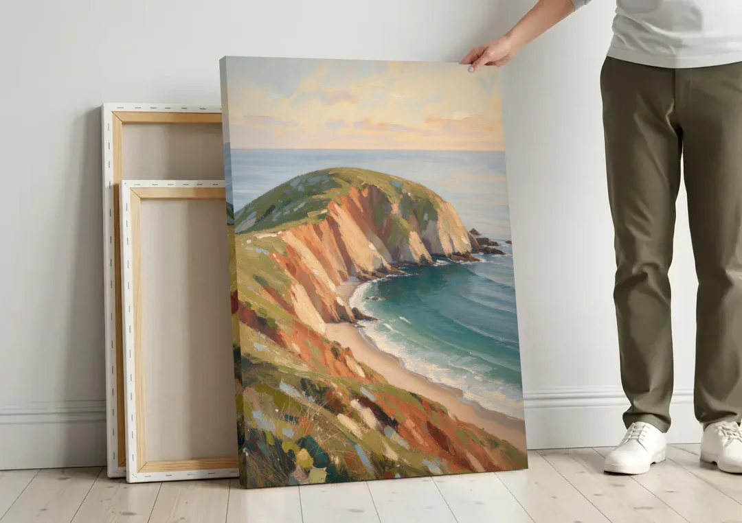 Coastal Canvas Prints of a Headland Cove canvas wall art leaning against a wall next to blank canvases