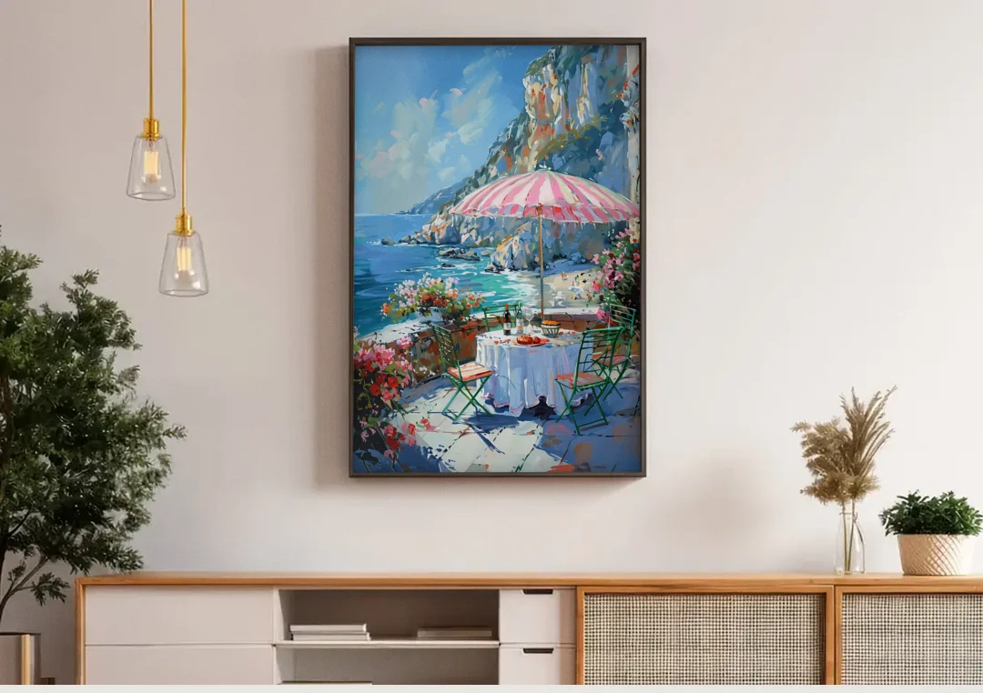 Coastal Painting with a Pink Striped Umbrella canvas wall art above a wooden sideboard under pendant lights