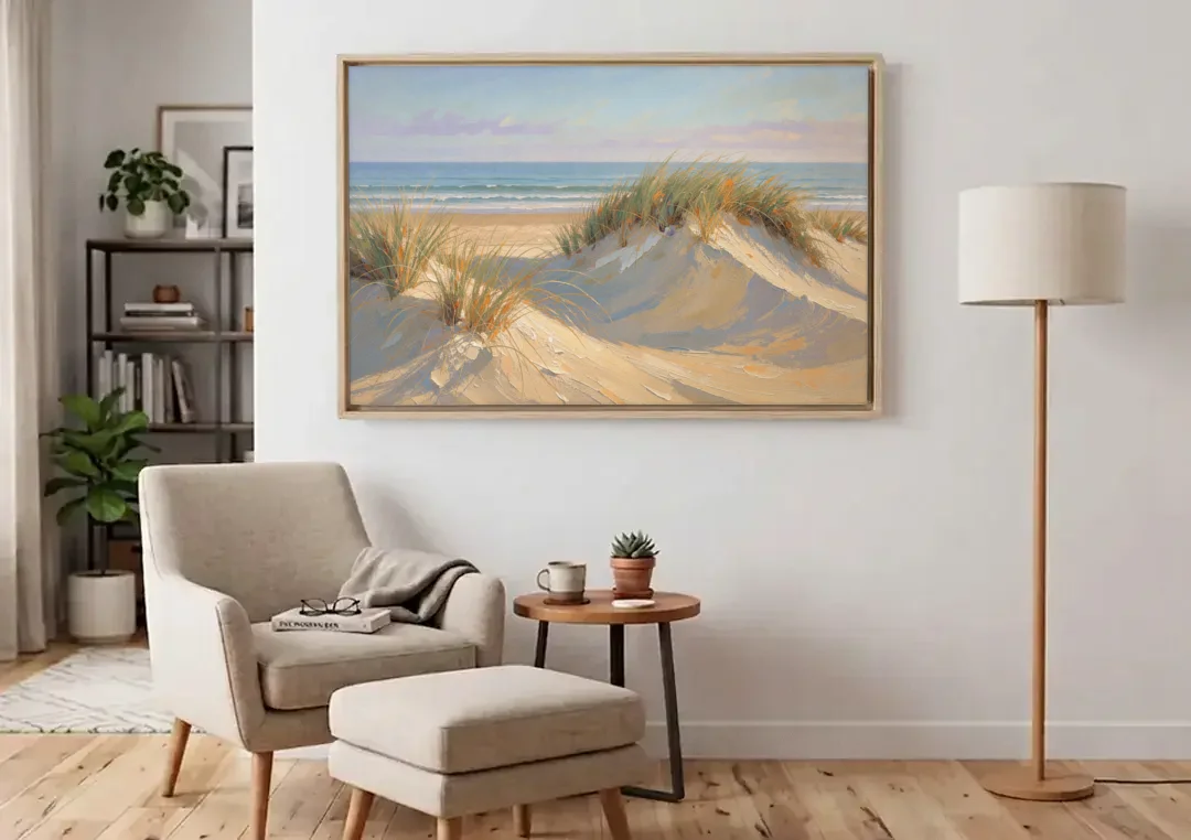Coastal Paintings of Sea Grass Dunes canvas wall art above an armchair in a bright living room