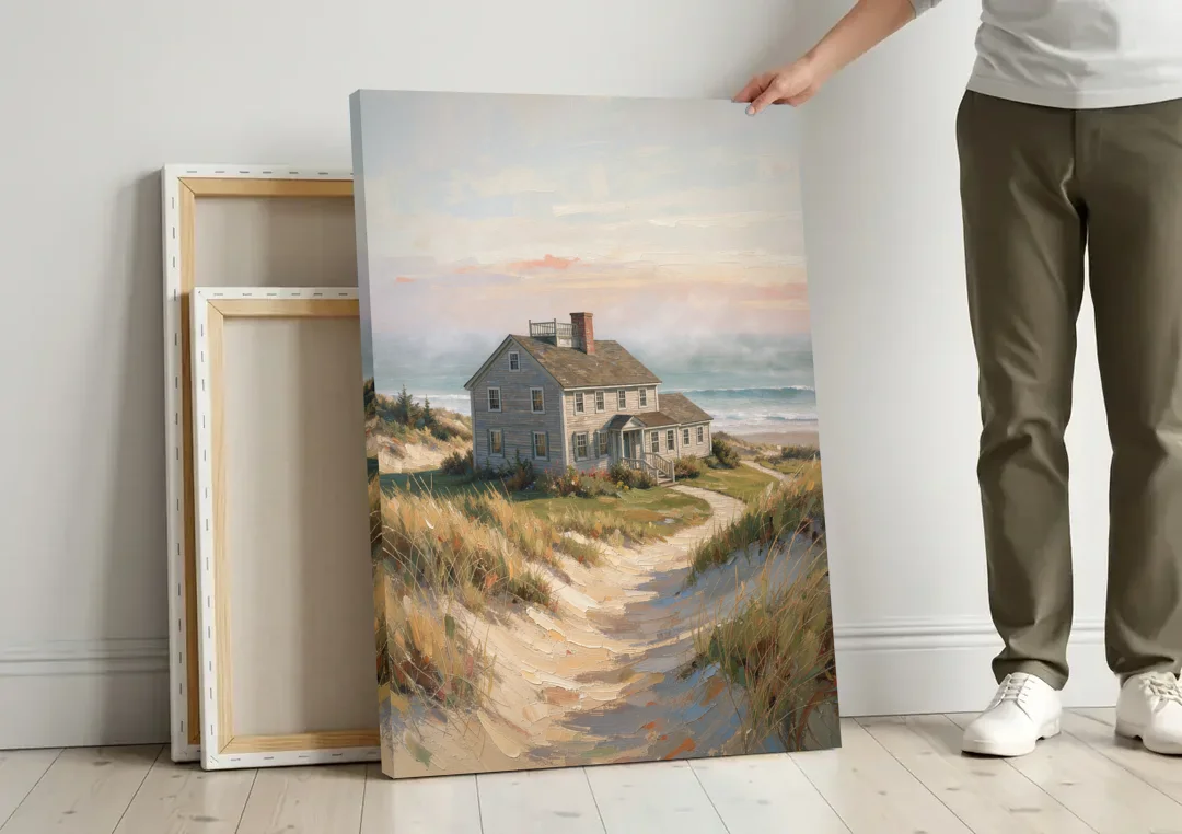 Coastal Wall Art for Living Room with Foggy Saltbox canvas wall art leaning against a wall next to blank canvases