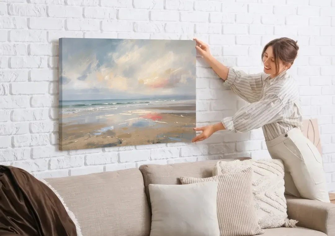 Coastal Wall Art of a Misty Low Tide Shore canvas wall art being hung on a white brick wall above a sofa