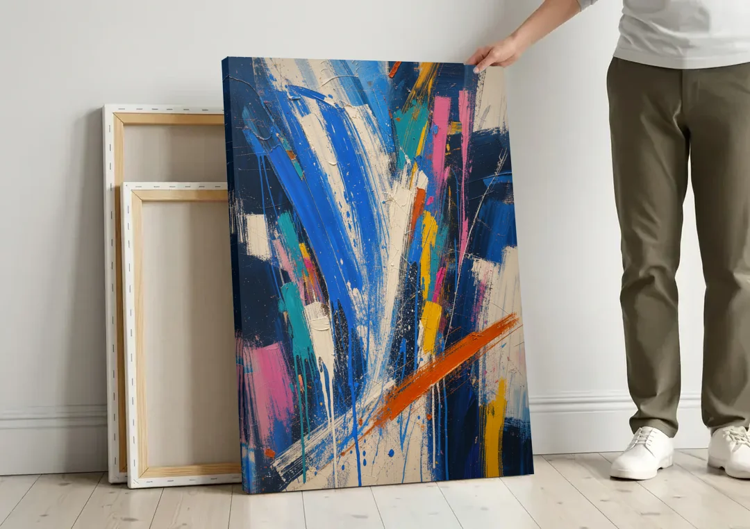 Cobalt Blue Abstract Art with Burnt Orange Slash canvas wall art leaning against a wall next to blank canvases