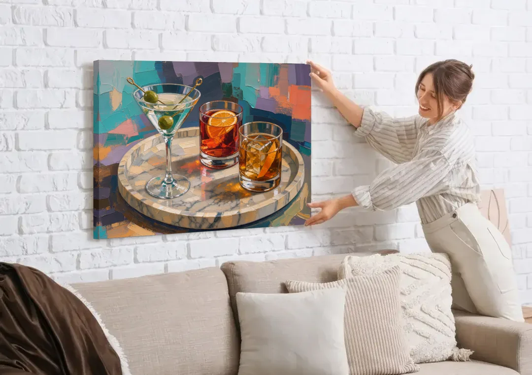 Cocktail Painting on a Marble Tray canvas wall art being hung on a white brick wall above a sofa