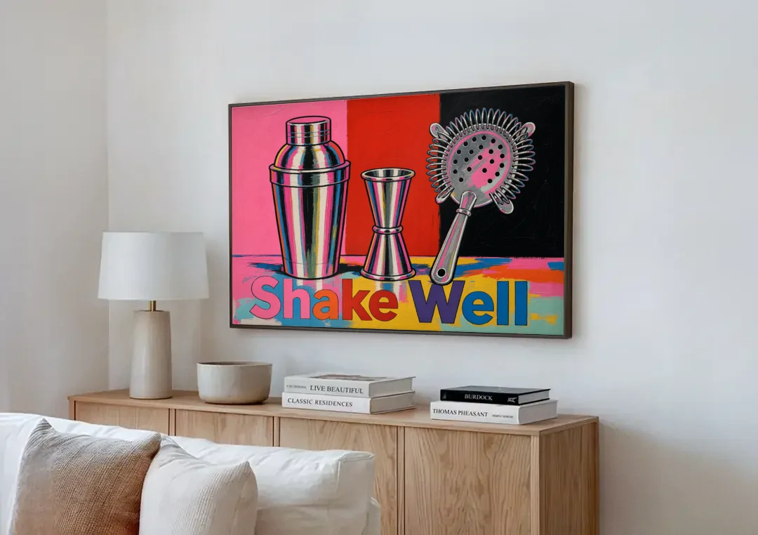 Cocktail Shaker Painting with Jigger and Strainer canvas wall art above a wooden sideboard next to a sofa