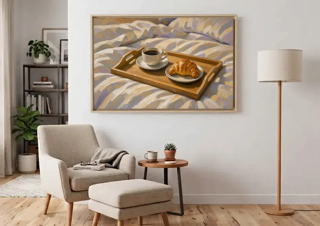 Coffee and Croissant Painting on a Breakfast Tray canvas wall art above an armchair in a bright living room