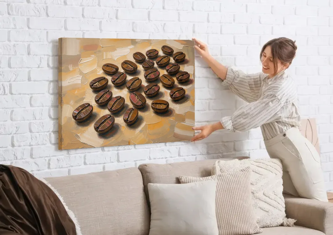 Coffee Bean Painting Scattered on Amber canvas wall art being hung on a white brick wall above a sofa