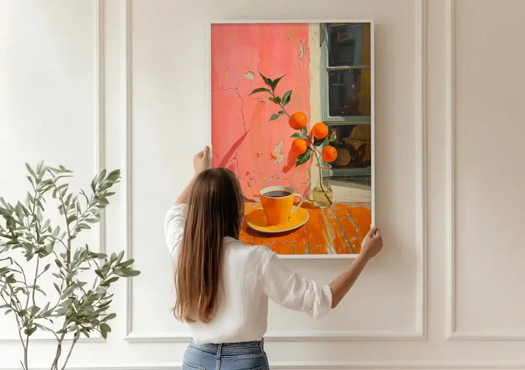 Coffee Painting with an Orange Sprig canvas wall art being hung on a paneled wall