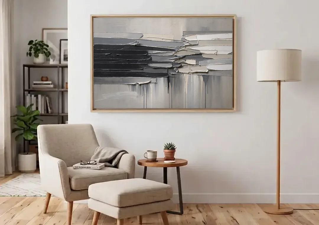 Contemporary Black and White Colliding Impasto Slabs canvas wall art above an armchair in a bright living room