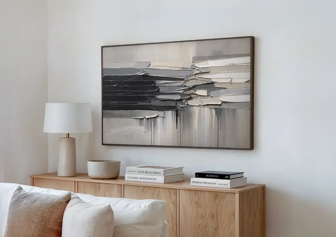 Contemporary Black and White Colliding Impasto Slabs canvas wall art above a wooden sideboard next to a sofa