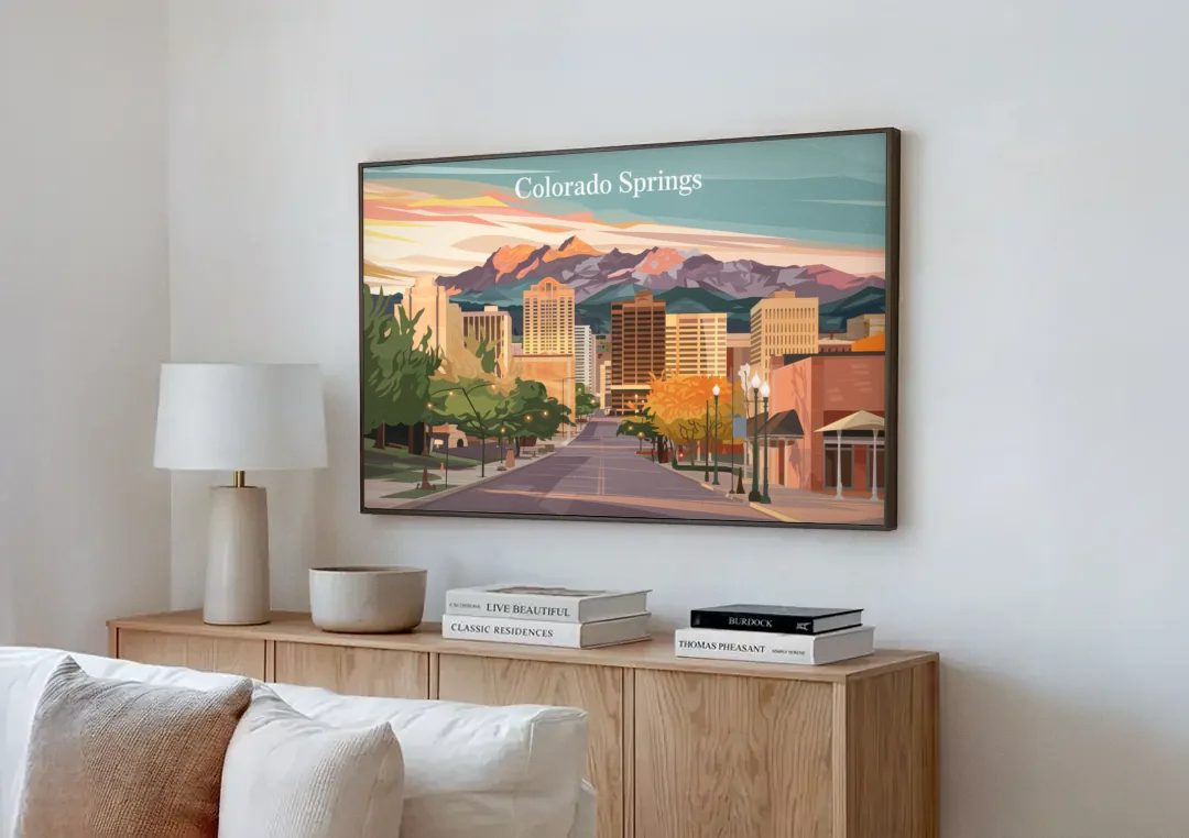 Colorado Springs Downtown Charm canvas wall art above a wooden sideboard next to a sofa