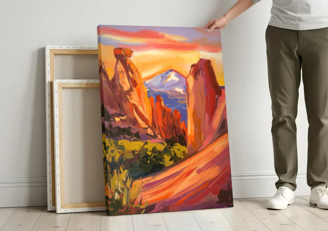 Colorado Springs Mountain View canvas wall art leaning against a wall next to blank canvases