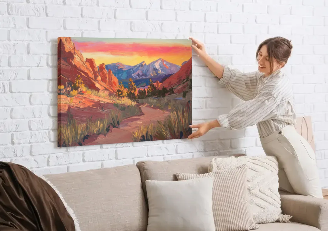 Colorado Springs Scenic Trails canvas wall art being hung on a white brick wall above a sofa