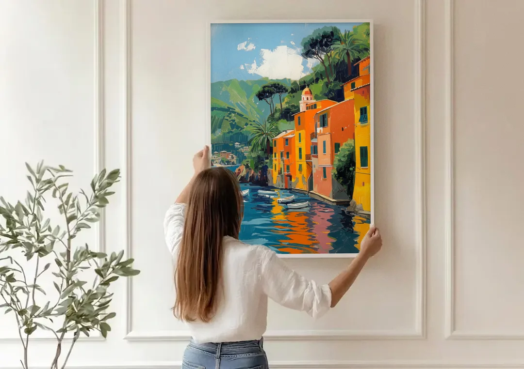 Colorful Houses Painting of Portofino canvas wall art being hung on a paneled wall