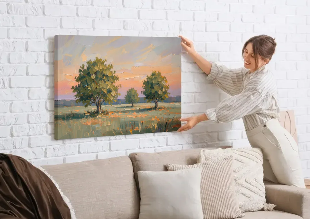 Contemporary Landscape Painting of Three Trees at Dusk canvas wall art being hung on a white brick wall above a sofa