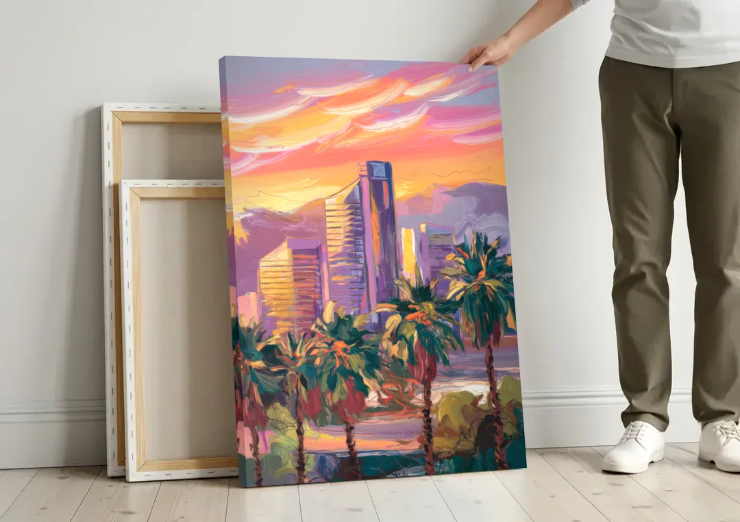 Corona Skyline Sunset canvas wall art leaning against a wall next to blank canvases