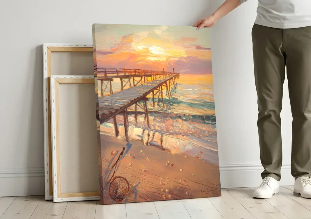 Corpus Christi Fishing Pier canvas wall art leaning against a wall next to blank canvases
