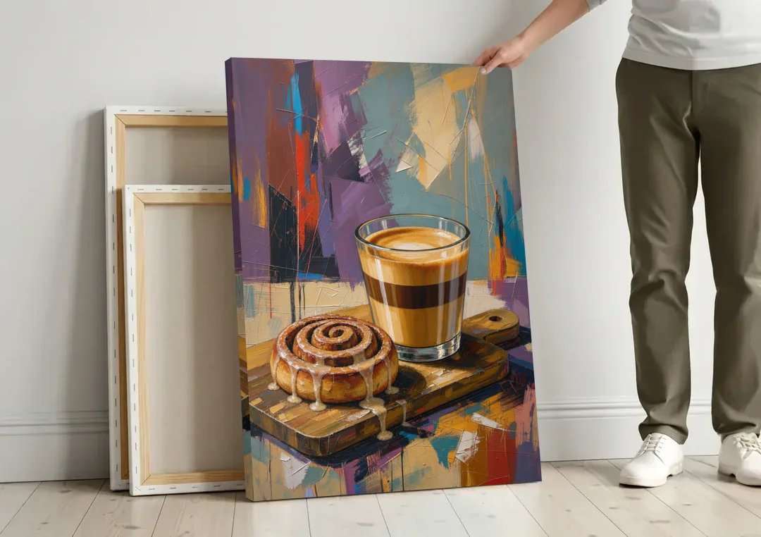 Cortado and Cinnamon Roll for the Coffee Bar canvas wall art leaning against a wall next to blank canvases