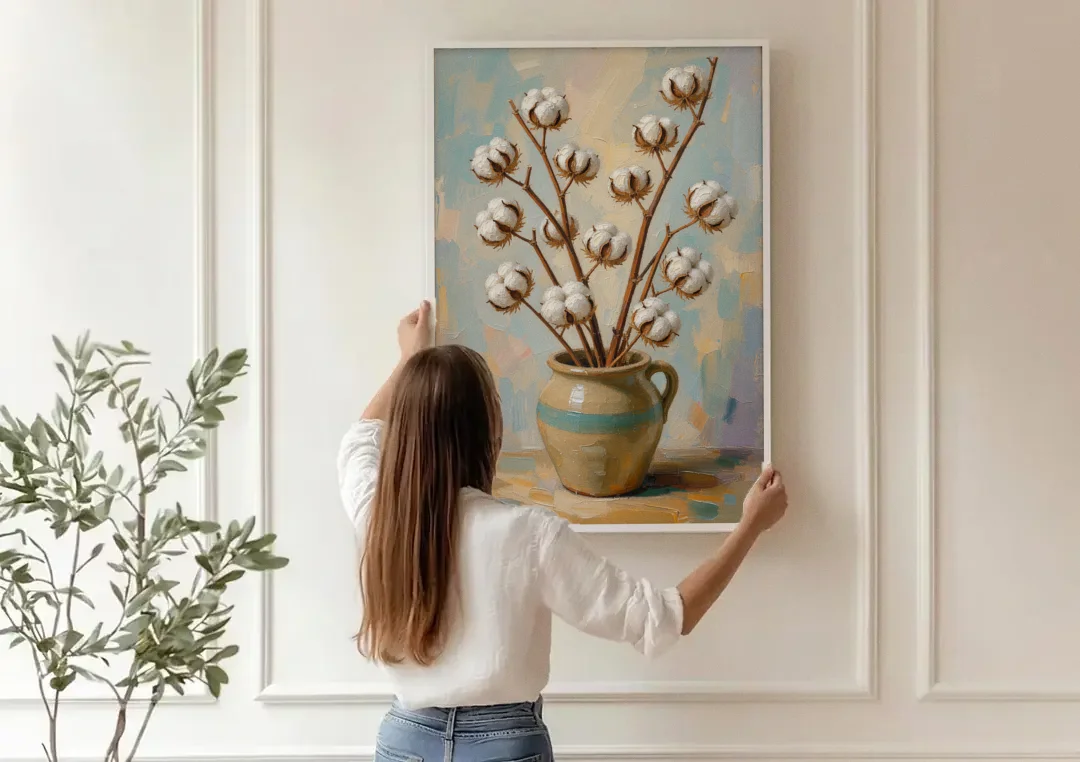 Cotton Painting Canvas in a Stoneware Crock canvas wall art being hung on a paneled wall
