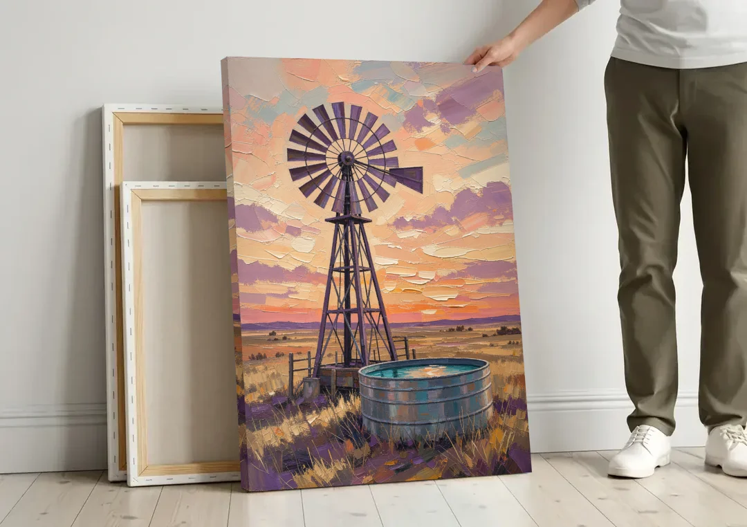 Country Prairie Windpump at Sunset canvas wall art leaning against a wall next to blank canvases