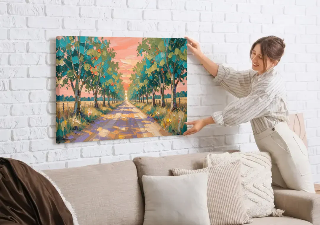 Country Road Painting Through Summer Trees canvas wall art being hung on a white brick wall above a sofa