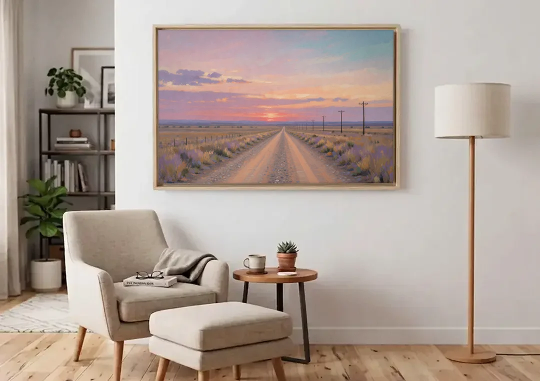 Country Road Wall Art at Prairie Twilight canvas wall art above an armchair in a bright living room
