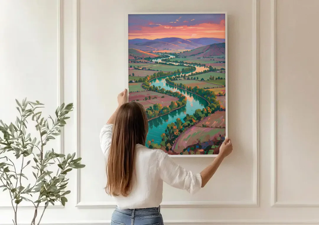 Countryside Oil Painting of a River Valley at Sunset canvas wall art being hung on a paneled wall