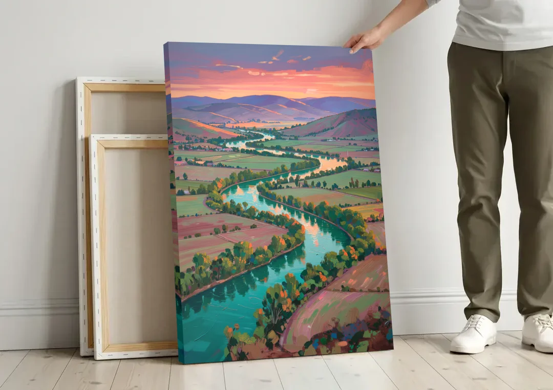 Countryside Oil Painting of a River Valley at Sunset canvas wall art leaning against a wall next to blank canvases