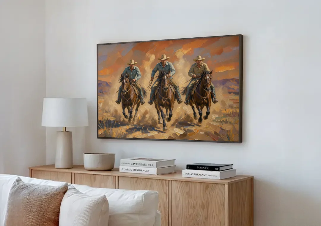 Cowboy Painting of Three Riders Out of the Dust canvas wall art above a wooden sideboard next to a sofa
