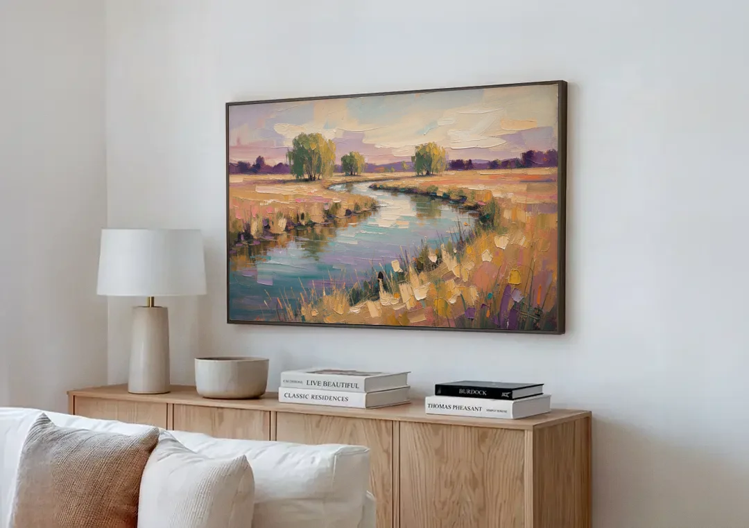 Creek Painting Winding Through a Summer Meadow canvas wall art above a wooden sideboard next to a sofa