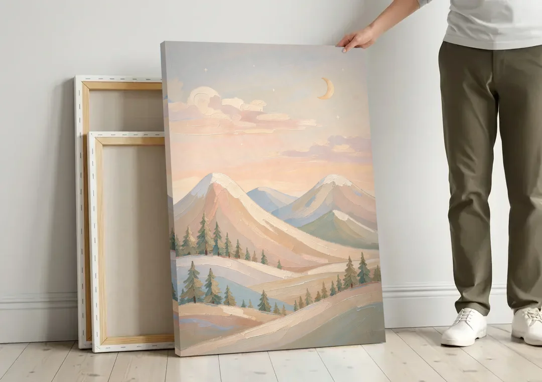 Crescent Moon Over Pastel Mountains for the Nursery canvas wall art leaning against a wall next to blank canvases