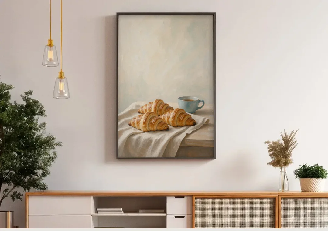 Croissant Painting with French Blue Coffee Cup canvas wall art above a wooden sideboard under pendant lights