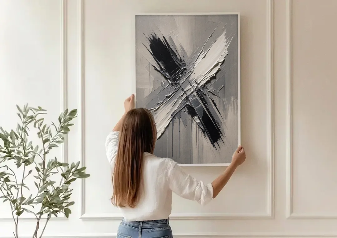 Crossed Black and White Knife Strokes for the Executive Office canvas wall art being hung on a paneled wall