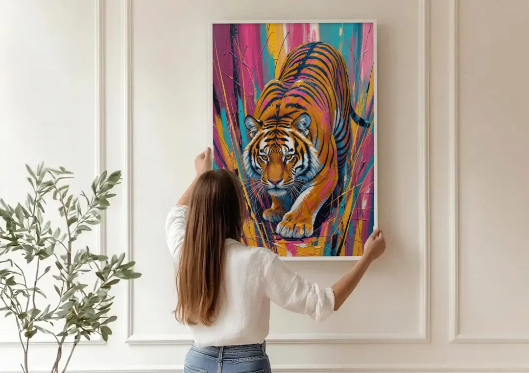 Crouching Tiger in Magenta and Teal Strokes canvas wall art being hung on a paneled wall