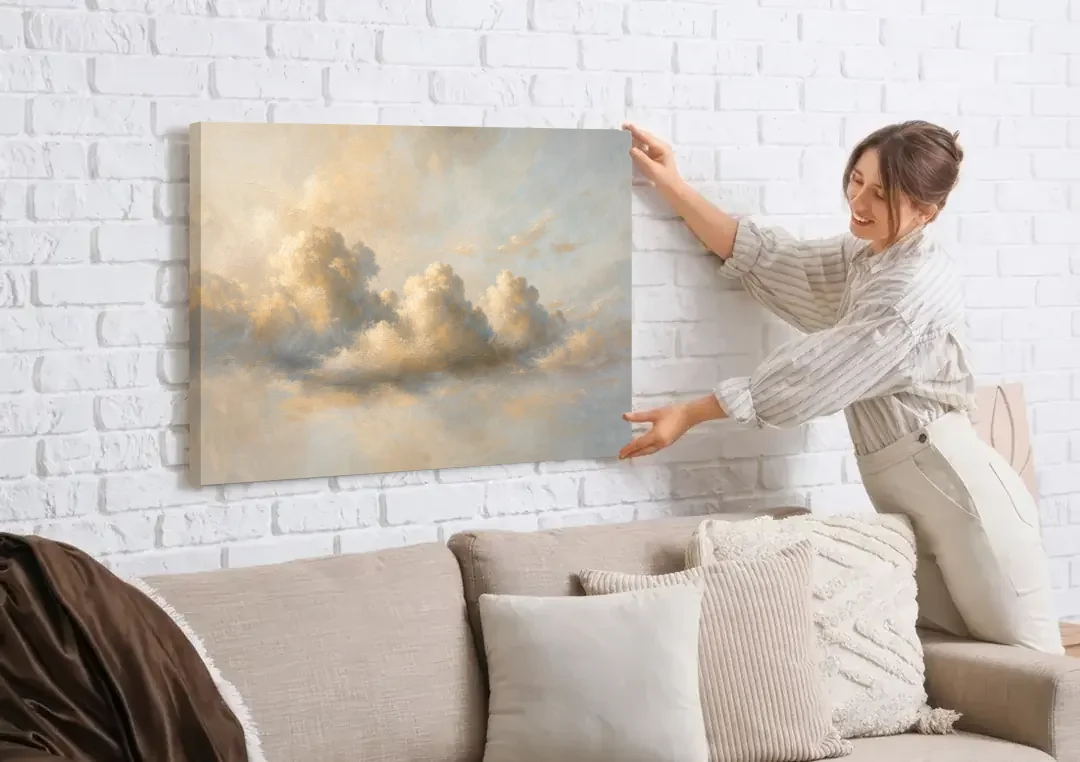 Cumulus Cloud Painting in Warm Sepia Light canvas wall art being hung on a white brick wall above a sofa