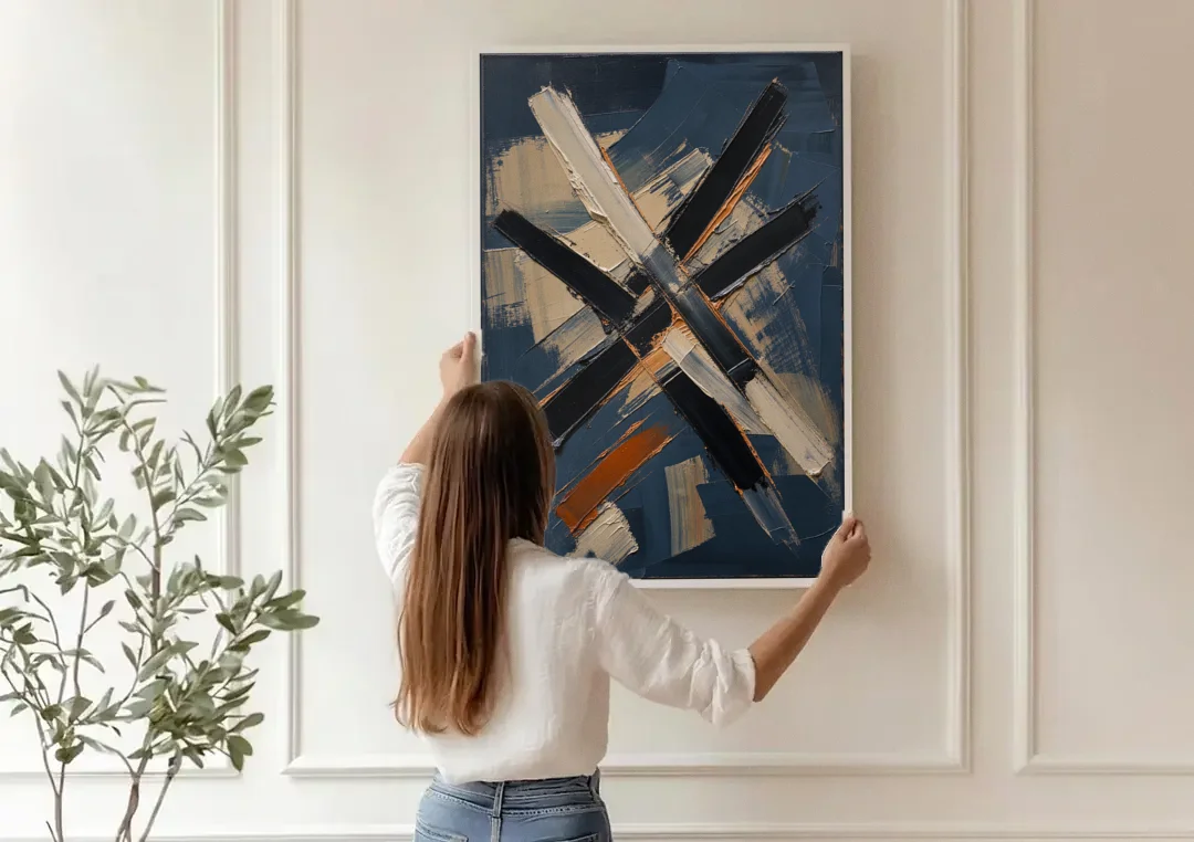 Dark Abstract Copper Crossings in Navy canvas wall art being hung on a paneled wall