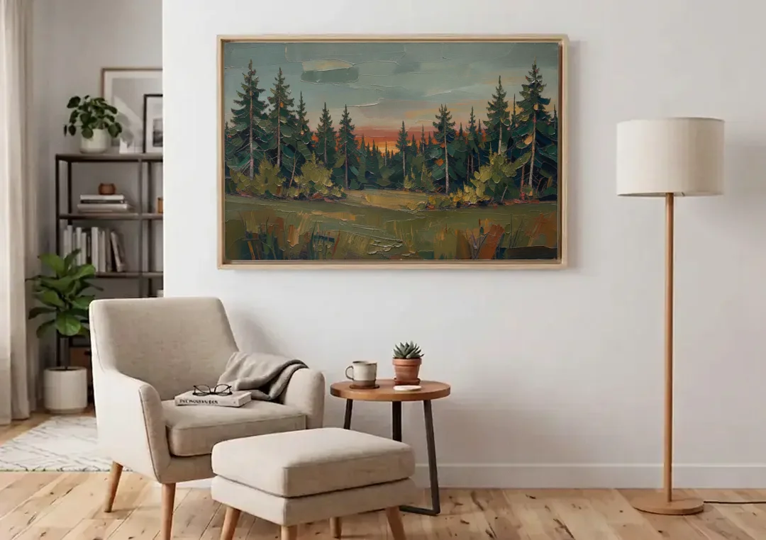 Dark Green Painting of Pines at Dusk canvas wall art above an armchair in a bright living room