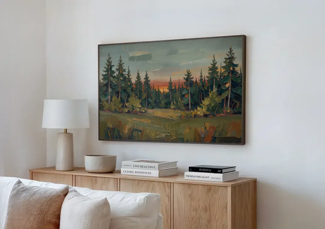 Dark Green Painting of Pines at Dusk canvas wall art above a wooden sideboard next to a sofa