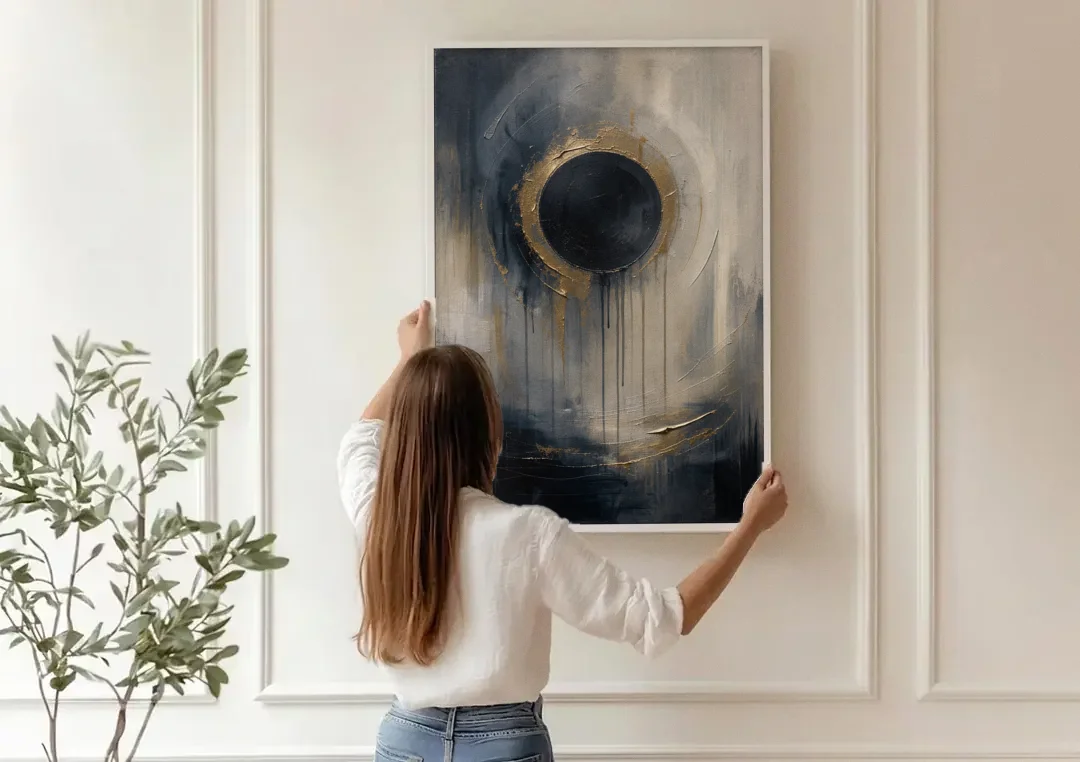 Dark Moody Abstract Bronze Eclipse canvas wall art being hung on a paneled wall