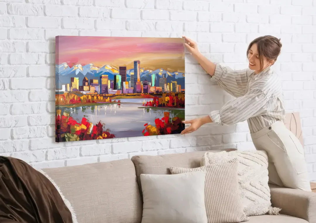 Denver Art Museum Highlights canvas wall art being hung on a white brick wall above a sofa