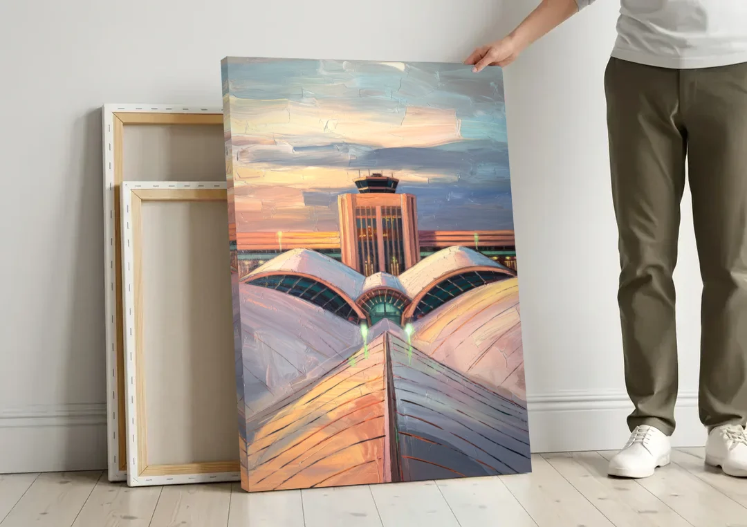 Denver International Terminal canvas wall art leaning against a wall next to blank canvases
