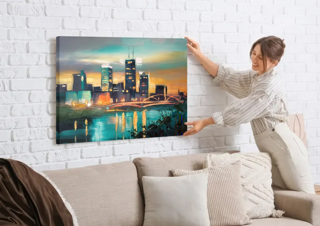 Des Moines Urban Charm canvas wall art being hung on a white brick wall above a sofa