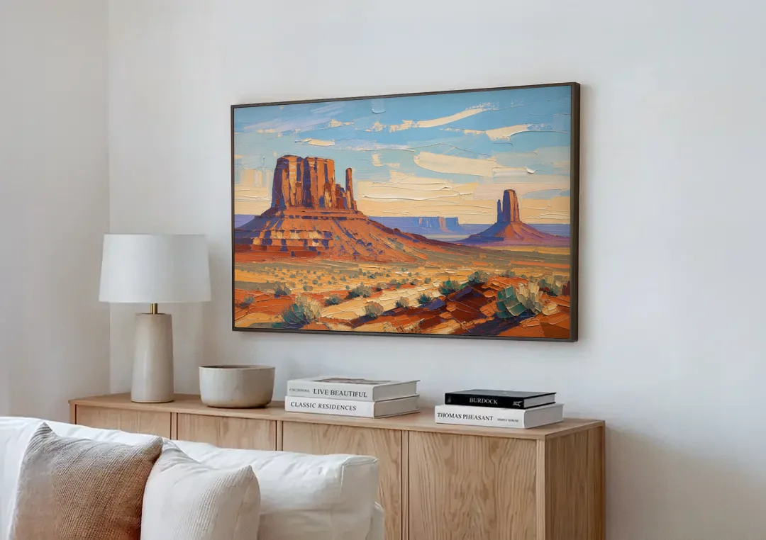 Desert Landscape Painting of Layered Mesas canvas wall art above a wooden sideboard next to a sofa