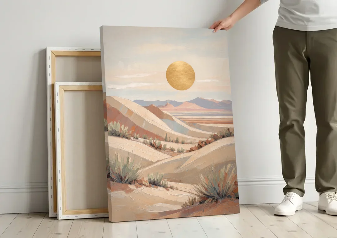 Boho Desert Mountain Ridges Under a Gold Sun canvas wall art leaning against a wall next to blank canvases