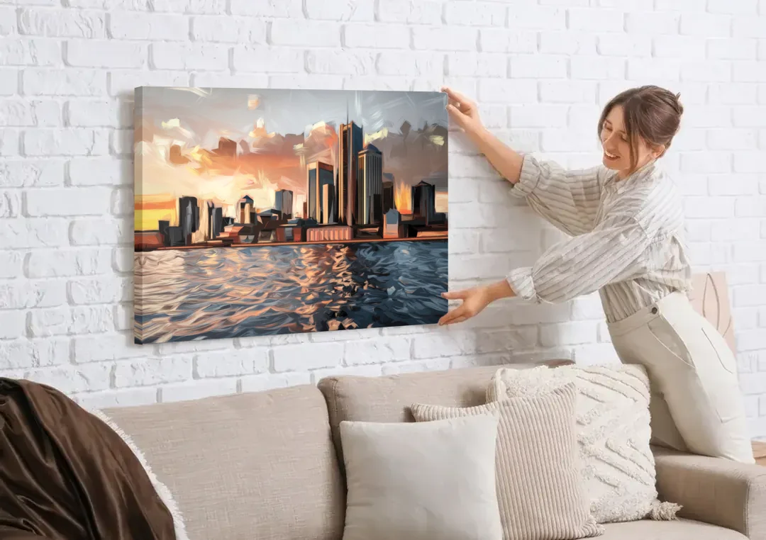 Detroit Cityscape Photography canvas wall art being hung on a white brick wall above a sofa