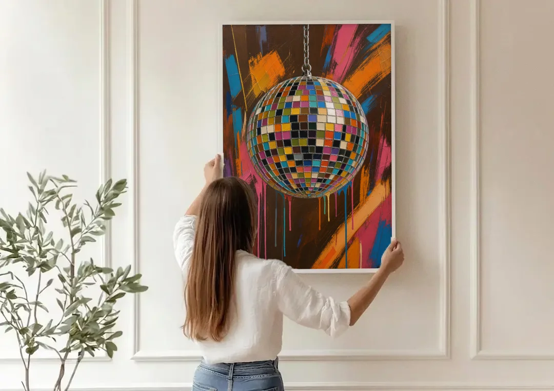 Disco Ball Painting in Bursting Color canvas wall art being hung on a paneled wall