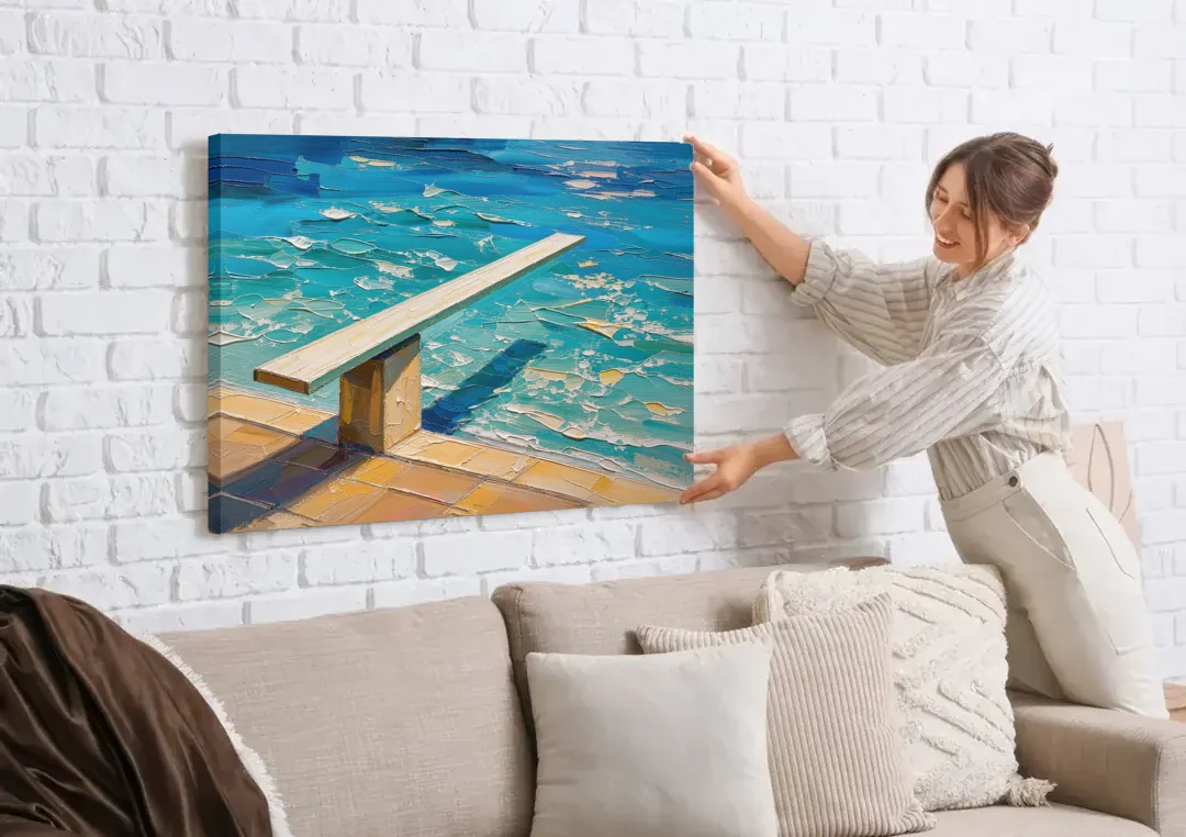 Diving Board Painting at High Noon canvas wall art being hung on a white brick wall above a sofa