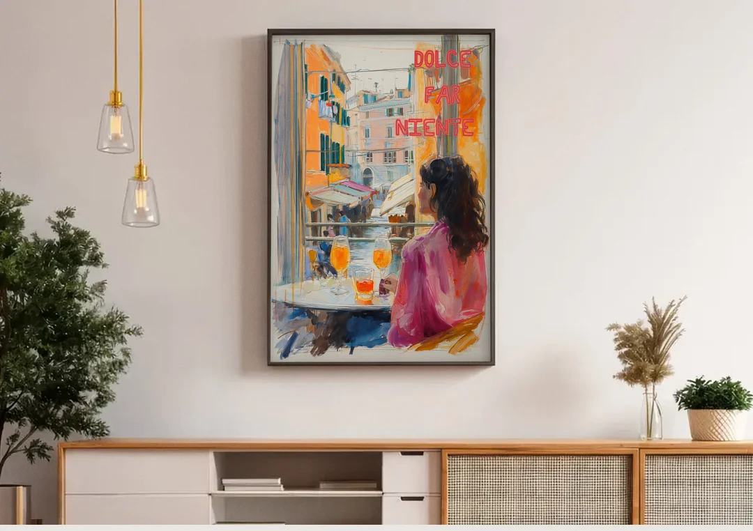 Dolce Far Niente Painting with a Spritz canvas wall art above a wooden sideboard under pendant lights