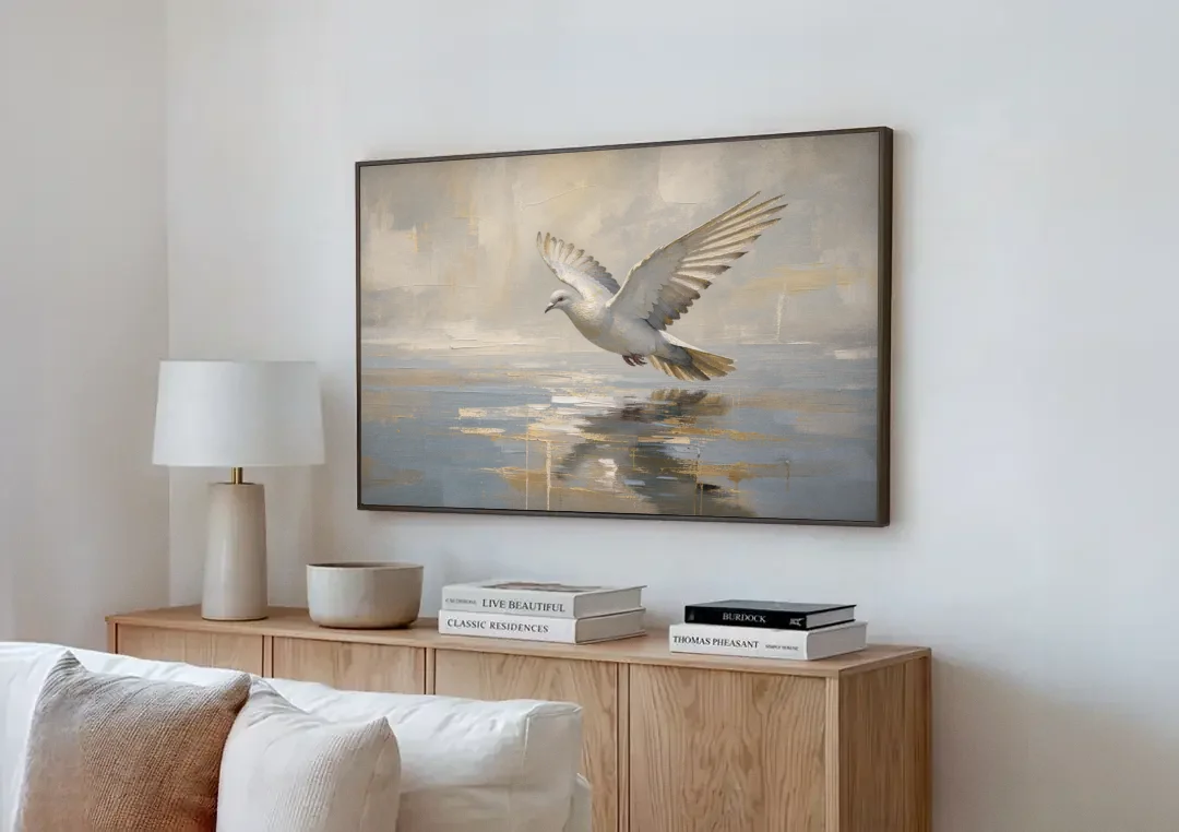Dove Wall Art with Wings Over Still Water canvas wall art above a wooden sideboard next to a sofa