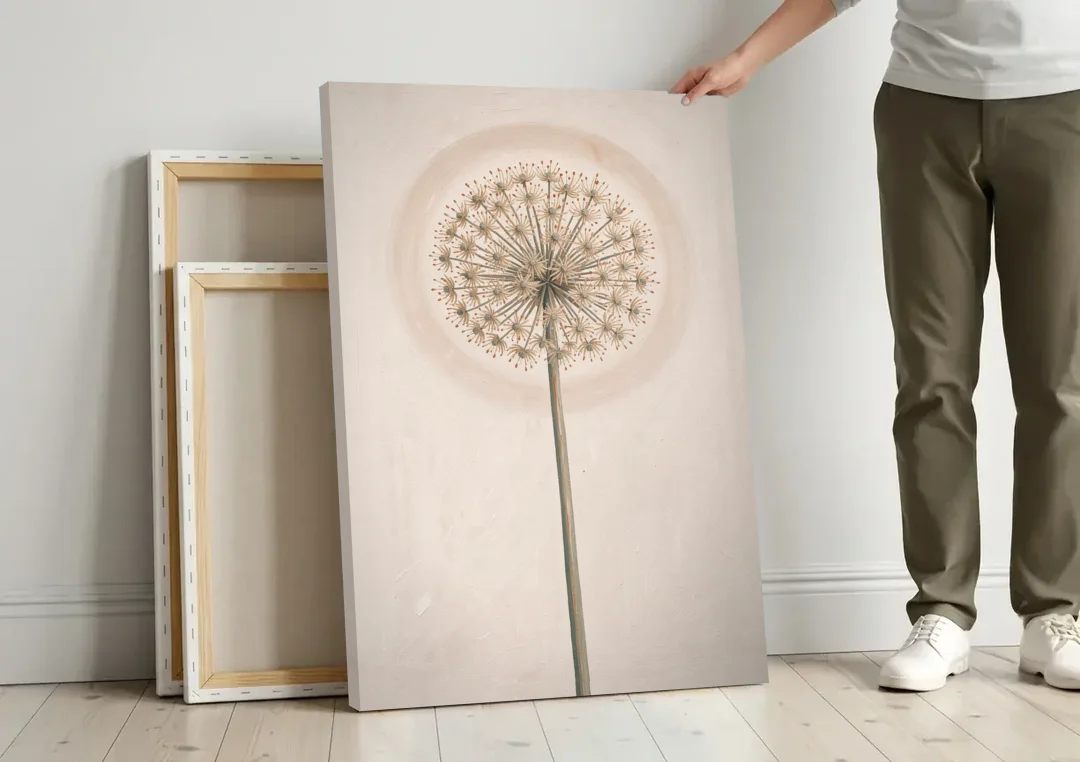 Dried Allium Seedhead on a Tall Stem canvas wall art leaning against a wall next to blank canvases